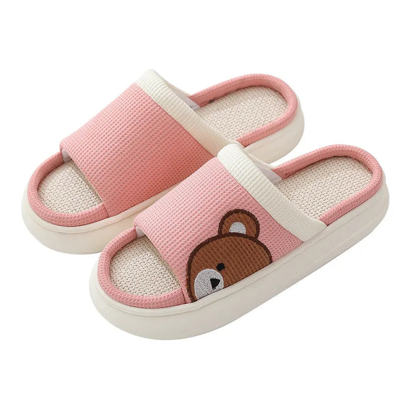 Pair of women's cartoon bear slippers with cotton linen upper and non-slip PVC sole, in light brown colour