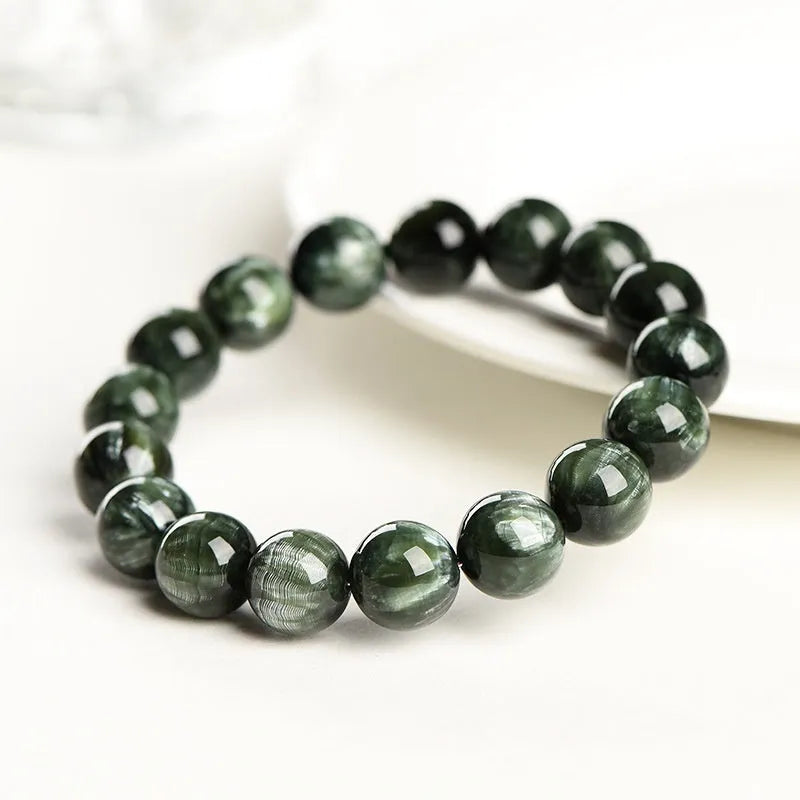 Green Dragon Crystal bracelet with 8-9mm round beads on a white background.