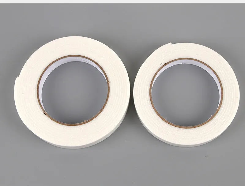 Roll of white foam double-sided adhesive tape showing its 3mm thickness and strong adhesive.