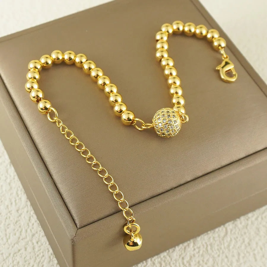 Women's copper bracelet with a heart-shaped design and a single ball zircon detail.