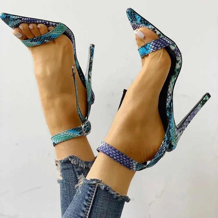 Blue women's high heel sandals with an ankle strap buckle and hollow-out detail.