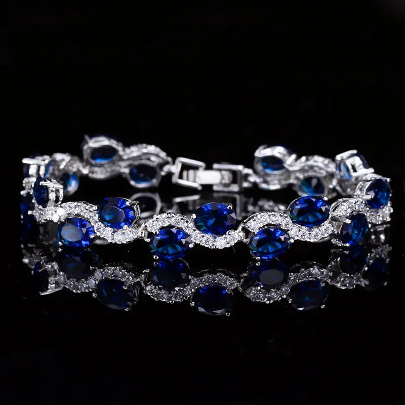 Copper gold electroplated bracelet with AAA+ zircon stones in geometric design measuring 18.4 cm length