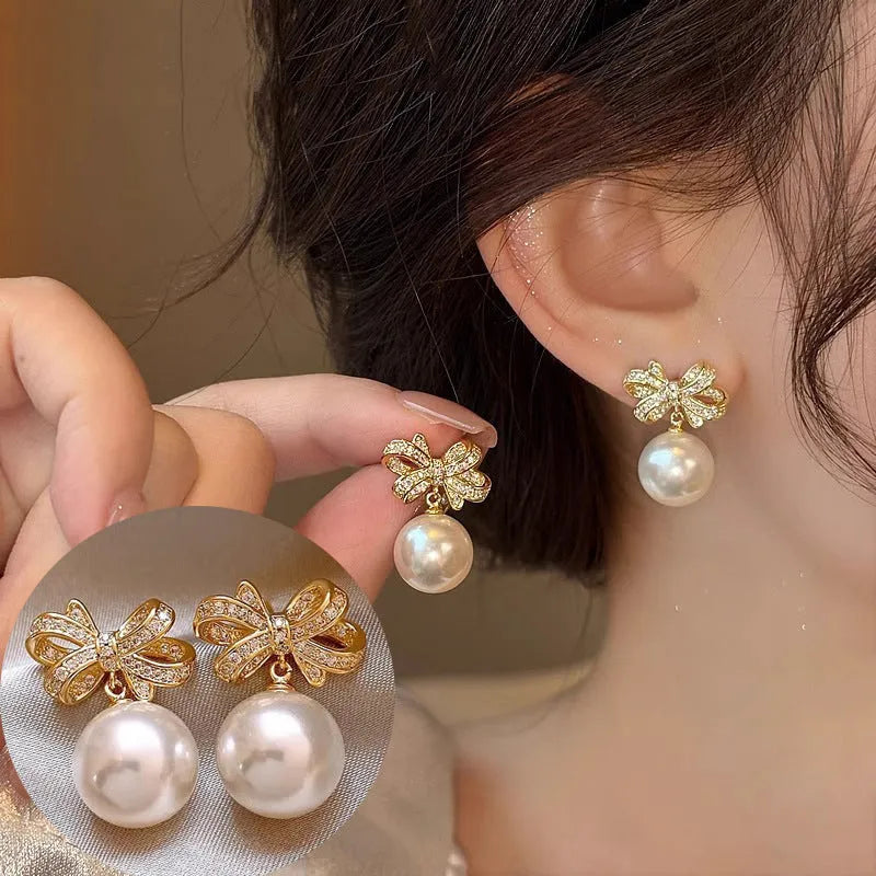 Gold tone bow pearl stud earrings, 12mm alloy women's earrings supplied as one pair