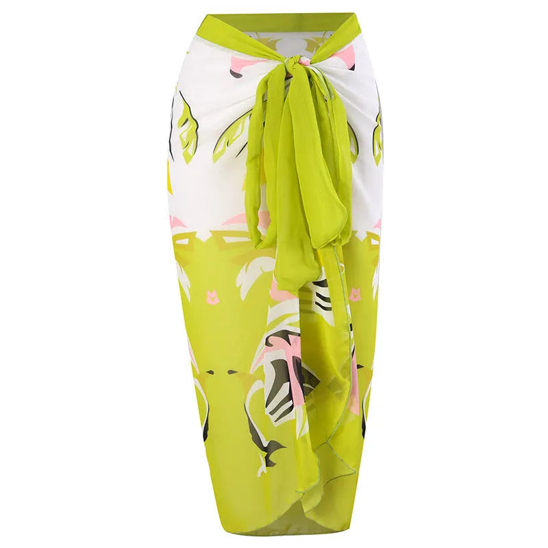 Women's blue printed one-piece swimsuit with matching gauze skirt set for swimming.