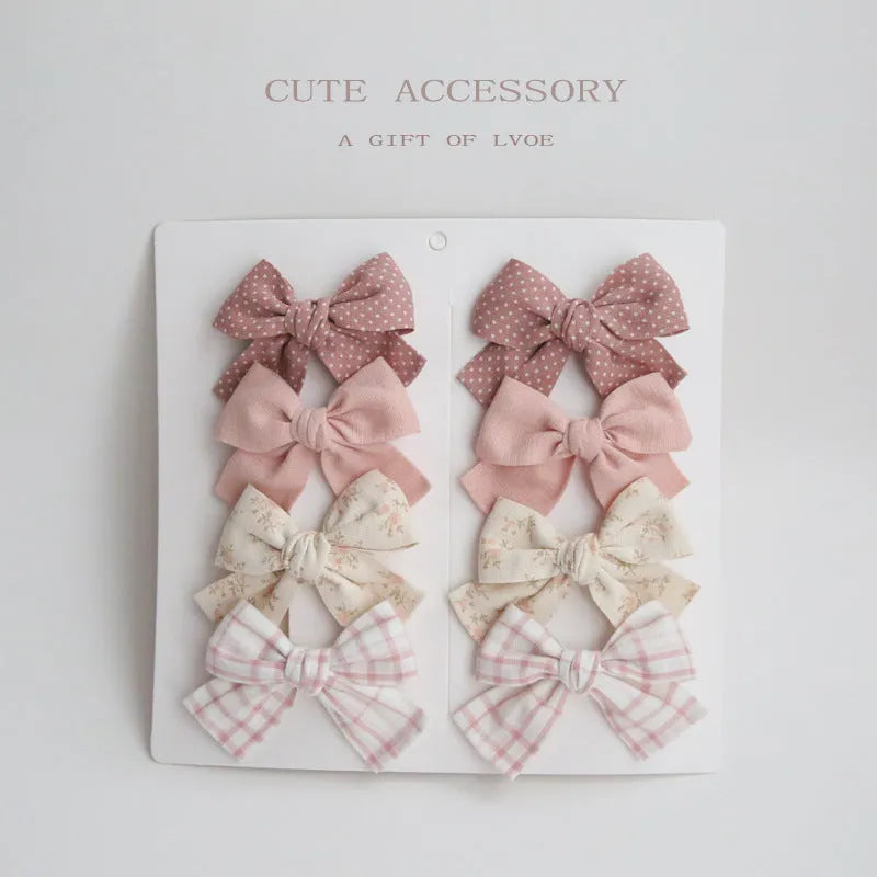 Dovetail bow hairclip set for children in cloth material with eight colour options
