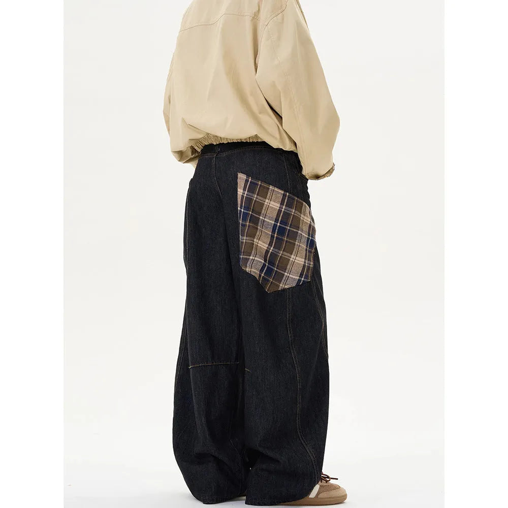 Loose straight-leg cotton trousers in a red plaid pattern, showing mid waist and casual fit.