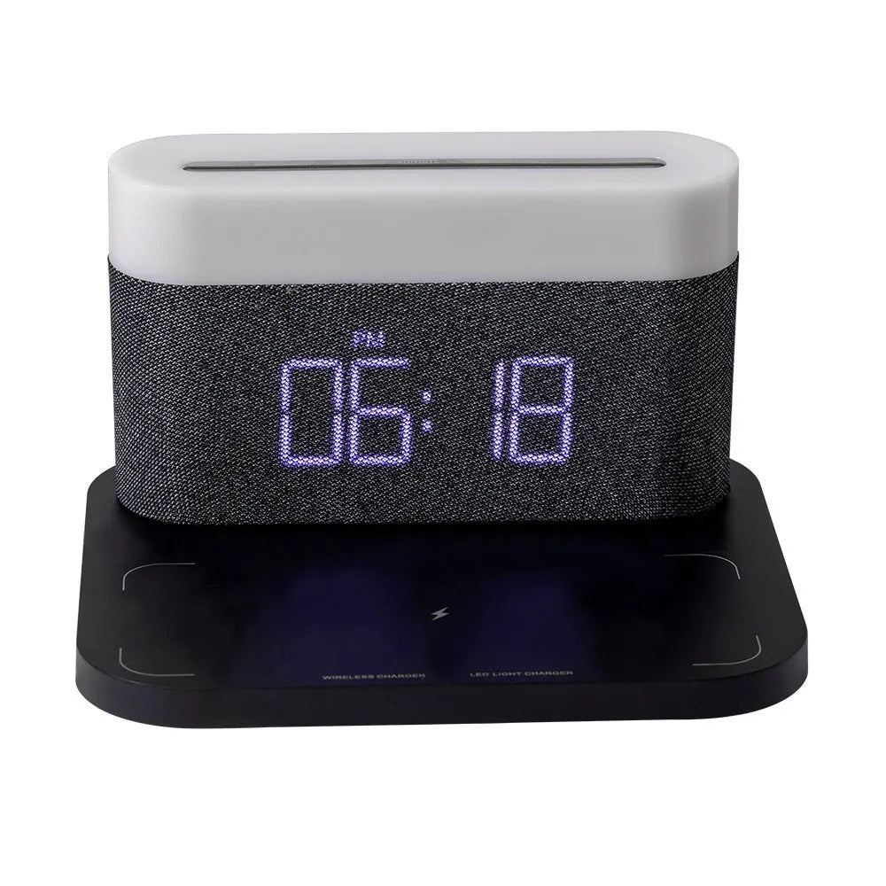 White wireless charging table lamp with integrated alarm clock on bedside table