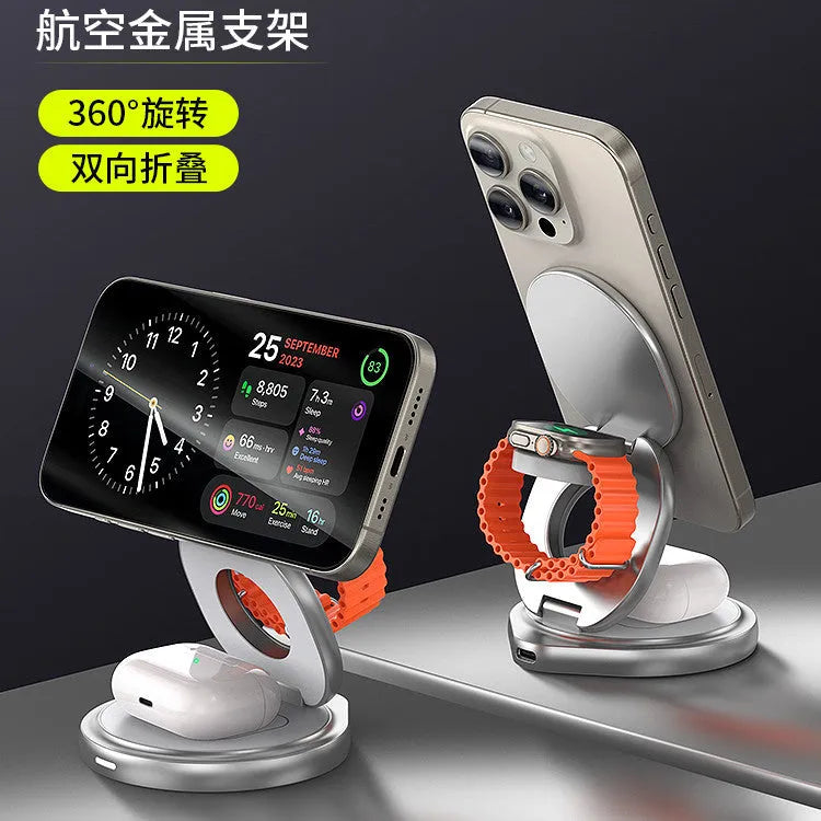 3-in-1 magnetic folding wireless charger stand in grey, with phone and headphones on a desk
