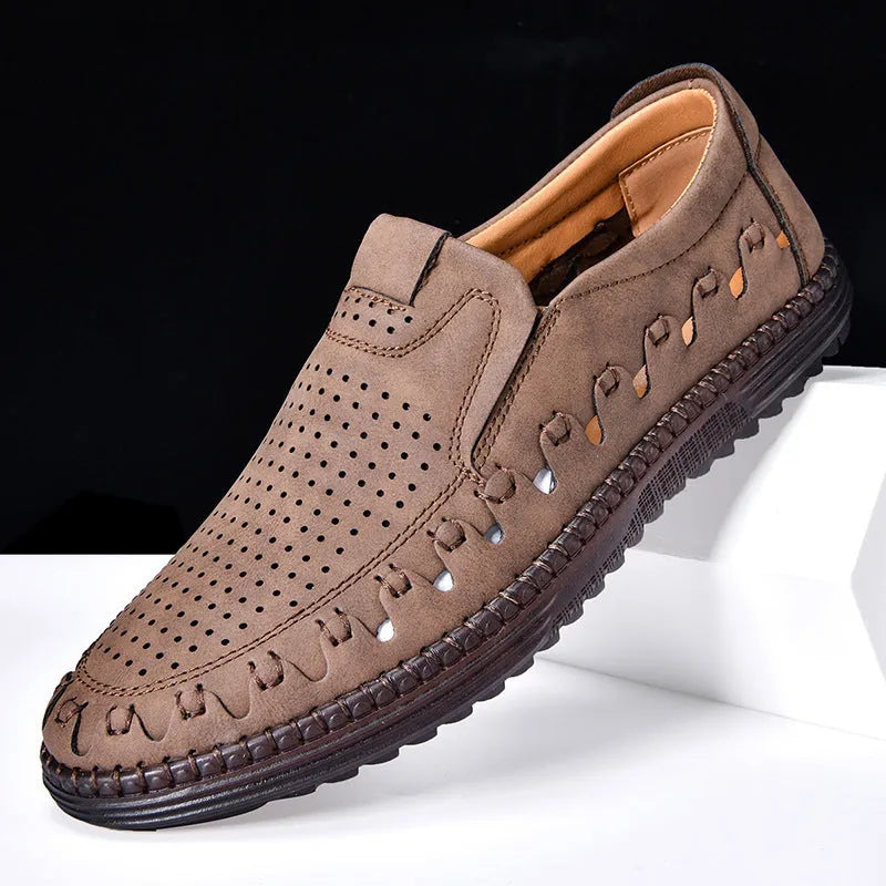 Men's brown handmade leather slip-on casual shoes with flat heel and round toe.