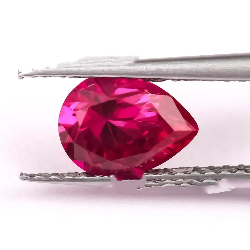 Artificial ruby gemstone in multiple cuts including round, princess square, and water drop shapes