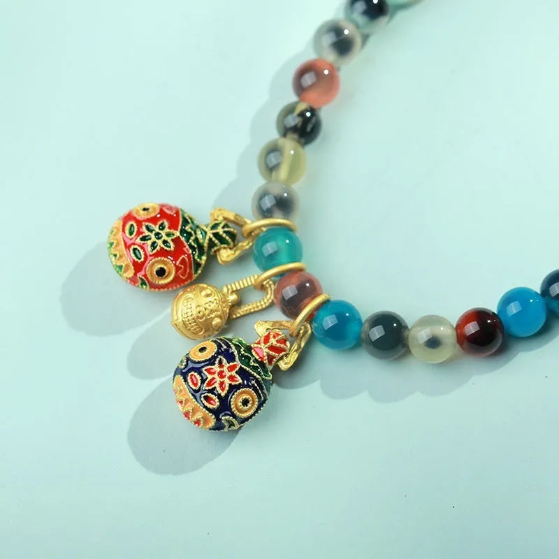 Women's natural agate snake bracelet with copper coin and coloured glaze decoration in choice of symbolic patterns