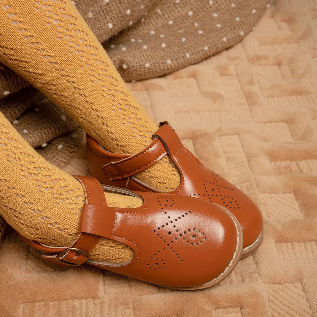 Girls British style PU leather shoes with hollow breathable upper and Velcro fastening, available in black