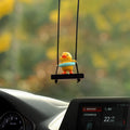 Yellow plastic duck car hanging ornament in cartoon style, shown in four design variants.