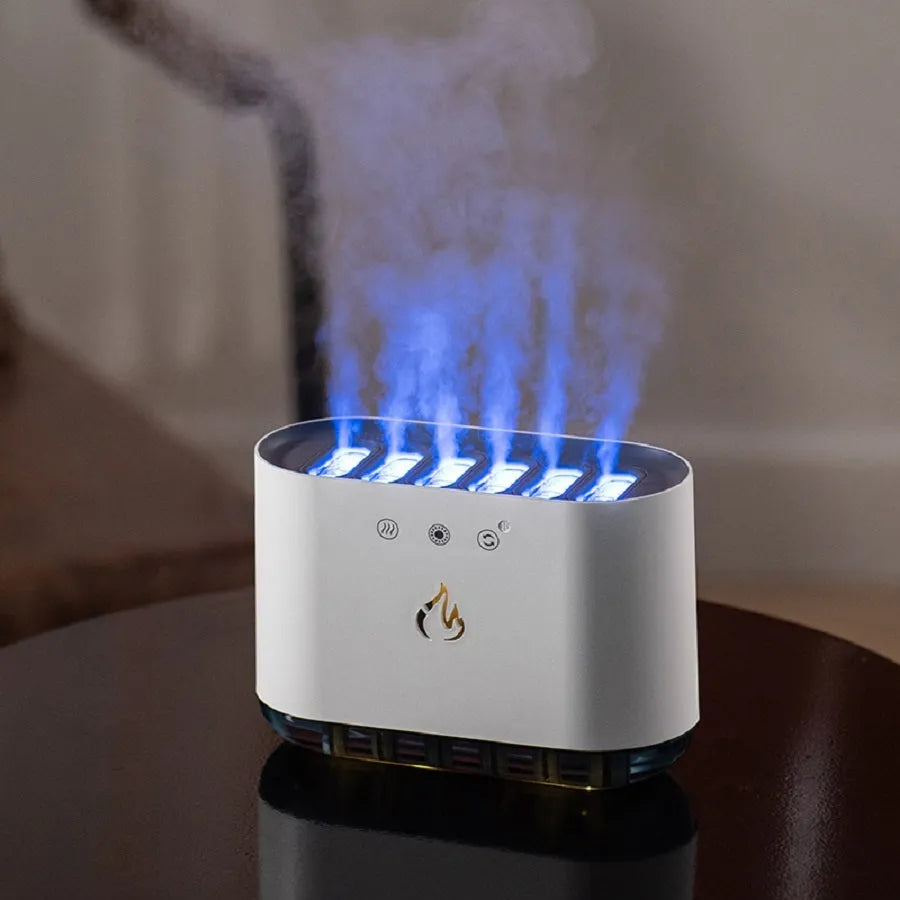 White large-capacity household humidifier with LED colourful lights and aromatherapy function on a table.