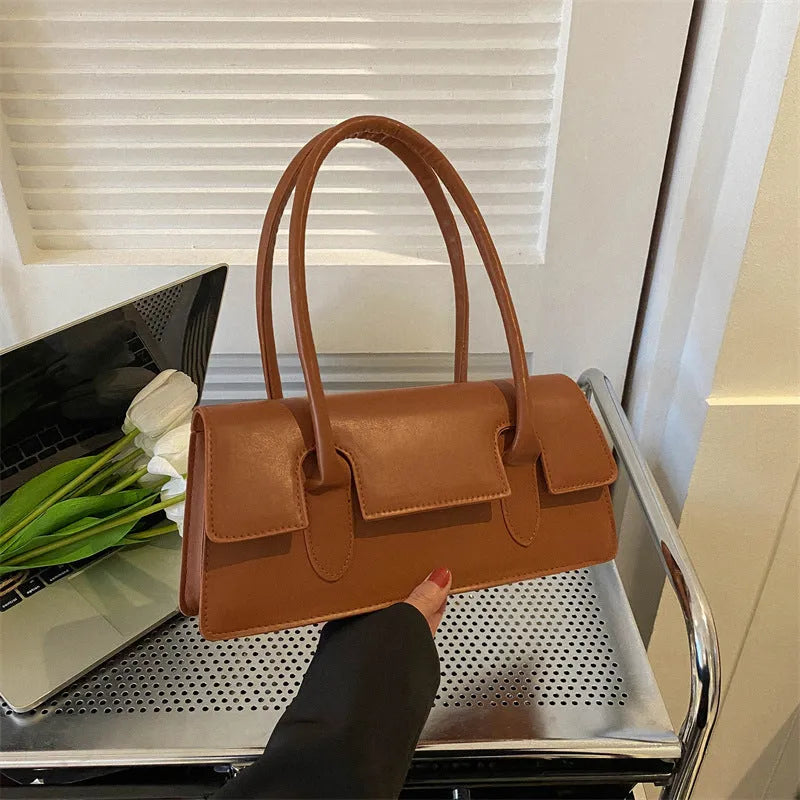 Women's black PU small square shoulder bag with single strap and stitching details