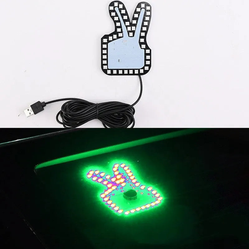 Car USB plug-in LED finger gesture lights showing thumbs up, OK, and scissor hand designs.