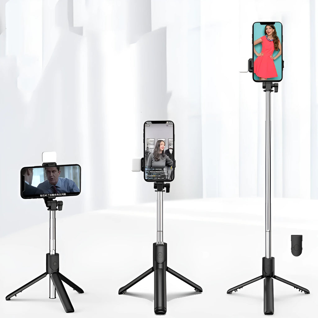 Black Bluetooth selfie stick with extended tripod legs and integrated fill light, holding a smartphone.