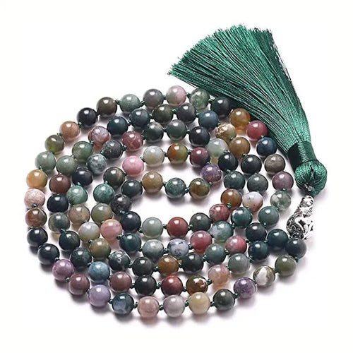 Long geometric agate tassel necklace with multi-coloured stones on a white background.