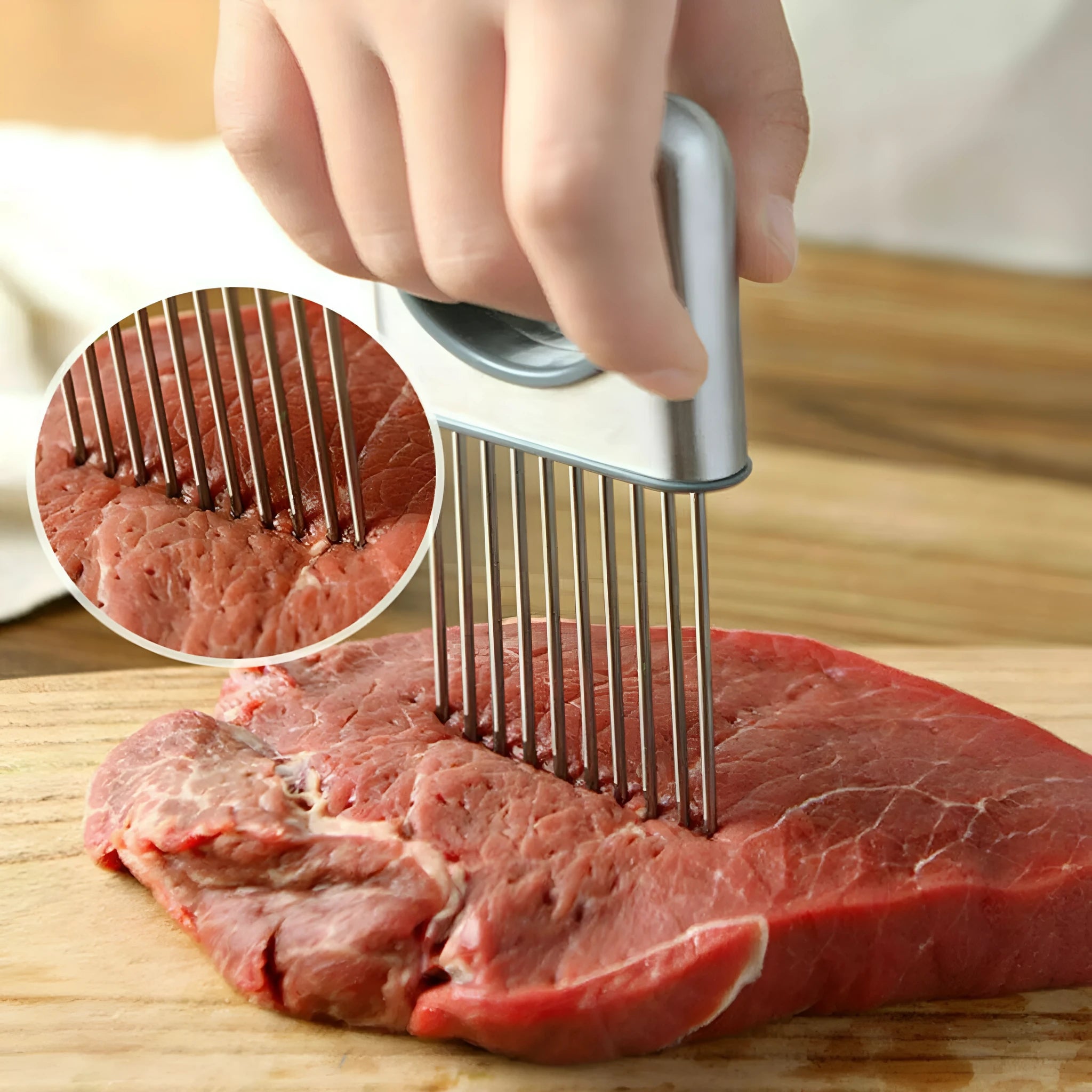 Stainless steel onion holder kitchen tool with sharp prongs and a red finger guard protector on a cutting board.