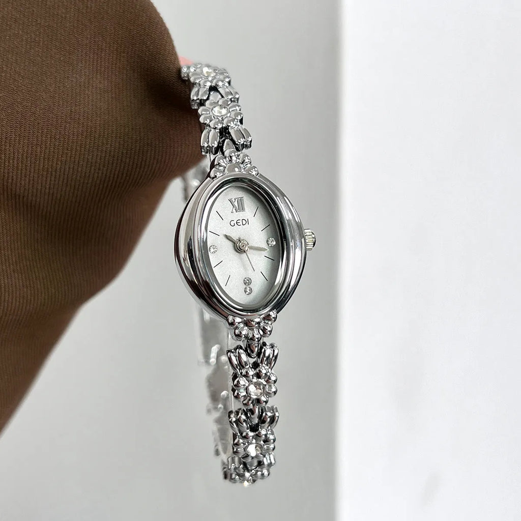 Women's compact alloy watch 8mm thick, one size, white or gold case with matching or contrasting dial and strap