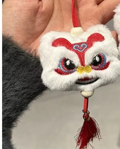 Chinese style blue plush lion keychain ornament with tassel and star stone decorative detail
