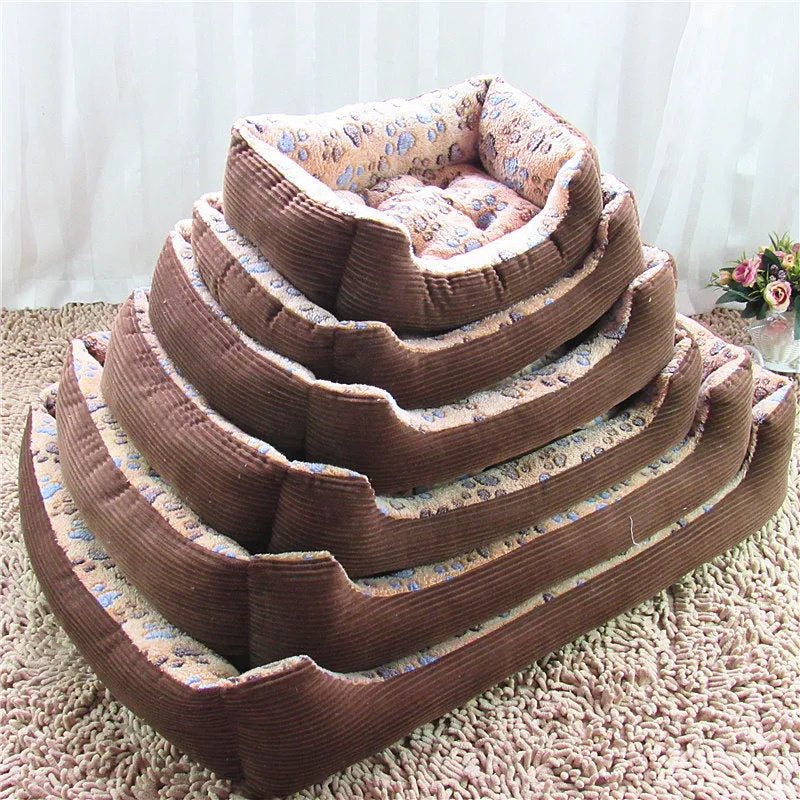 Beige sofa-style dog bed with plush fabric and raised bolsters for small dogs