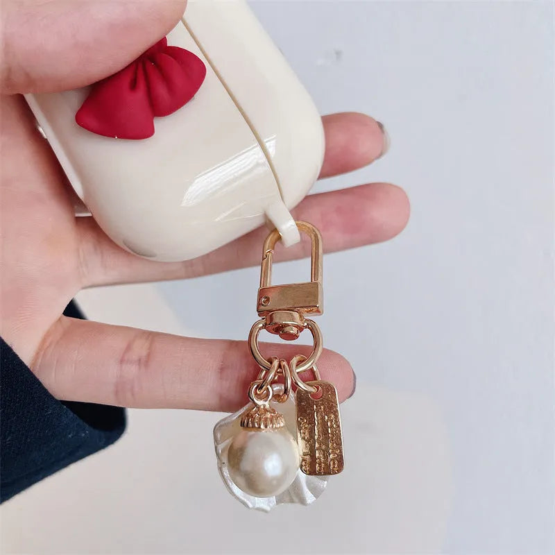 Beige red bow shell TPU clamshell case for AirPods Pro, AirPods 3, AirPods 1 and AirPods 2 wireless earphones