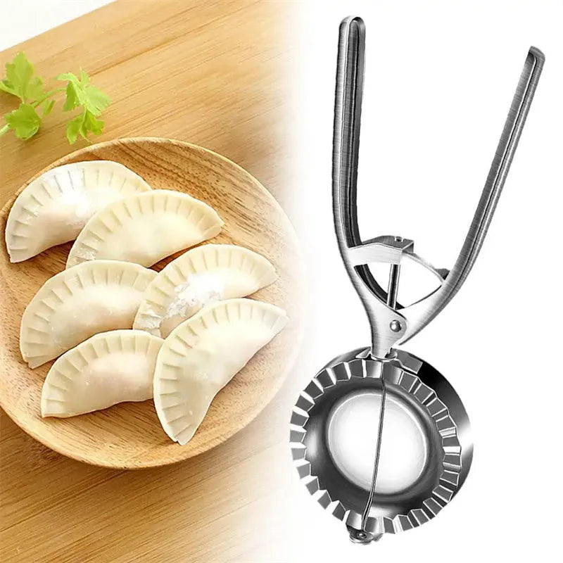 Silver stainless steel manual dumpling press tool on kitchen work surface