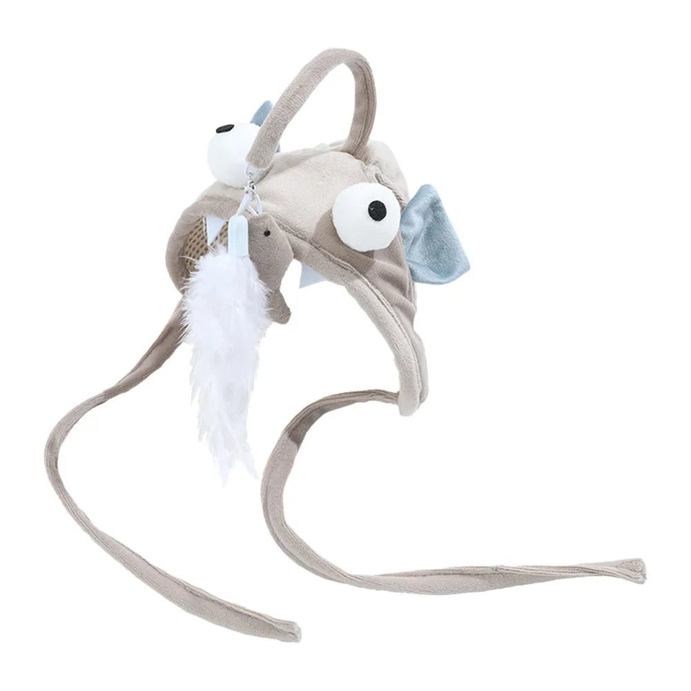 Grey dinosaur-themed cat headband toy with big eyes, a feather teaser, and an adjustable strap for hands-free play.