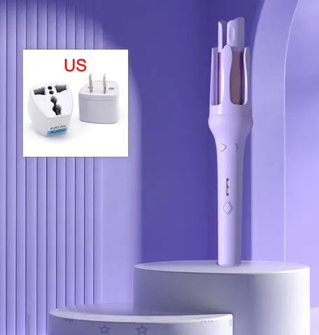 White and pink automatic hair curler with a 32mm rotating ceramic barrel and clamp, resting on a table with international power adapters.