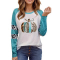 Sky blue long sleeve t-shirt with a white 3D digitally printed Halloween pumpkin graphic.