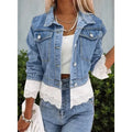 Blue women's denim jacket with lace stitching detail on the front, showing long sleeves.