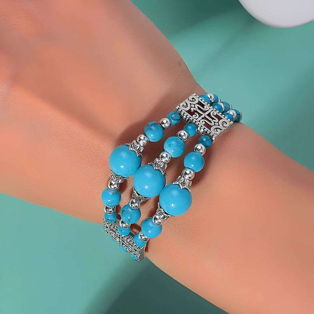 Tibetan style wide bangle bracelet with colourful beads, turquoise tone, tassel detail and electroplated alloy finish