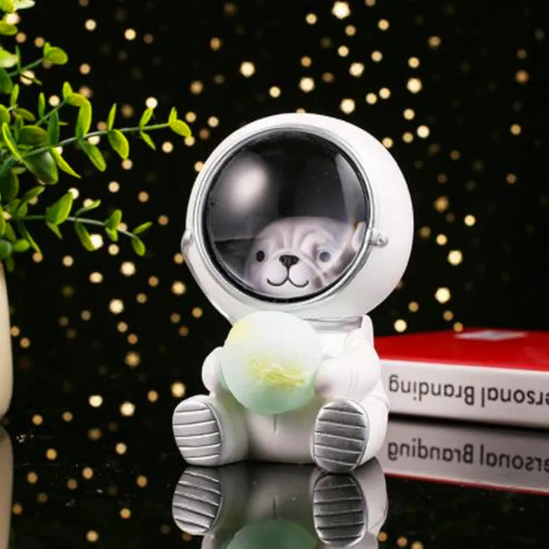 Resin bear-shaped starry sky night light with soft LED glow on a wooden table.