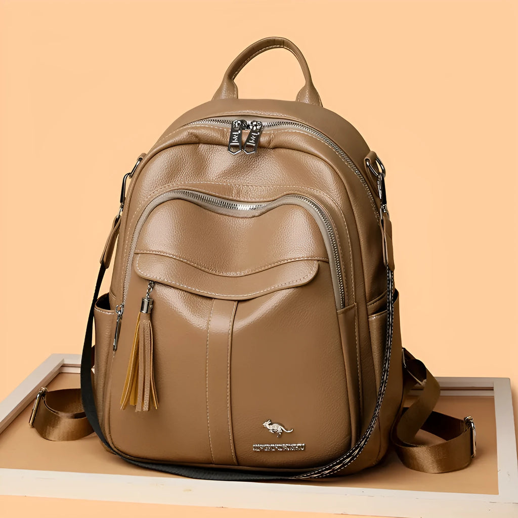 Genuine leather tassel backpack in khaki with fringe, stitching, anti-theft zippered hidden pocket and phone pocket