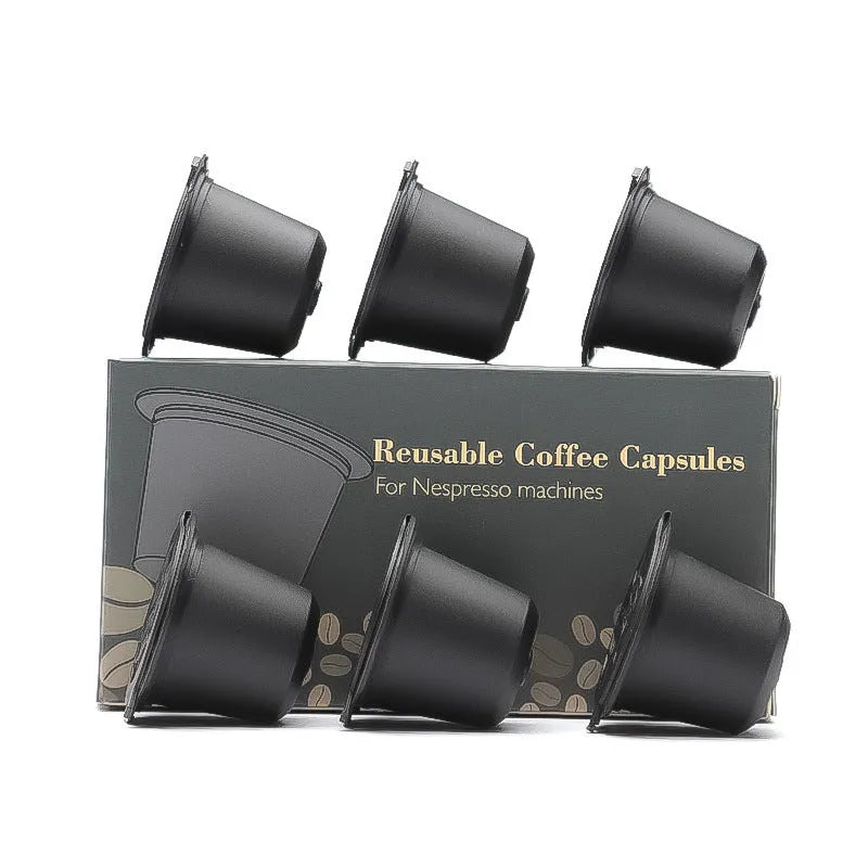 Six plastic coffee filter cups in black, red, and brown with a spoon, reusable shell capsule design for home brewing