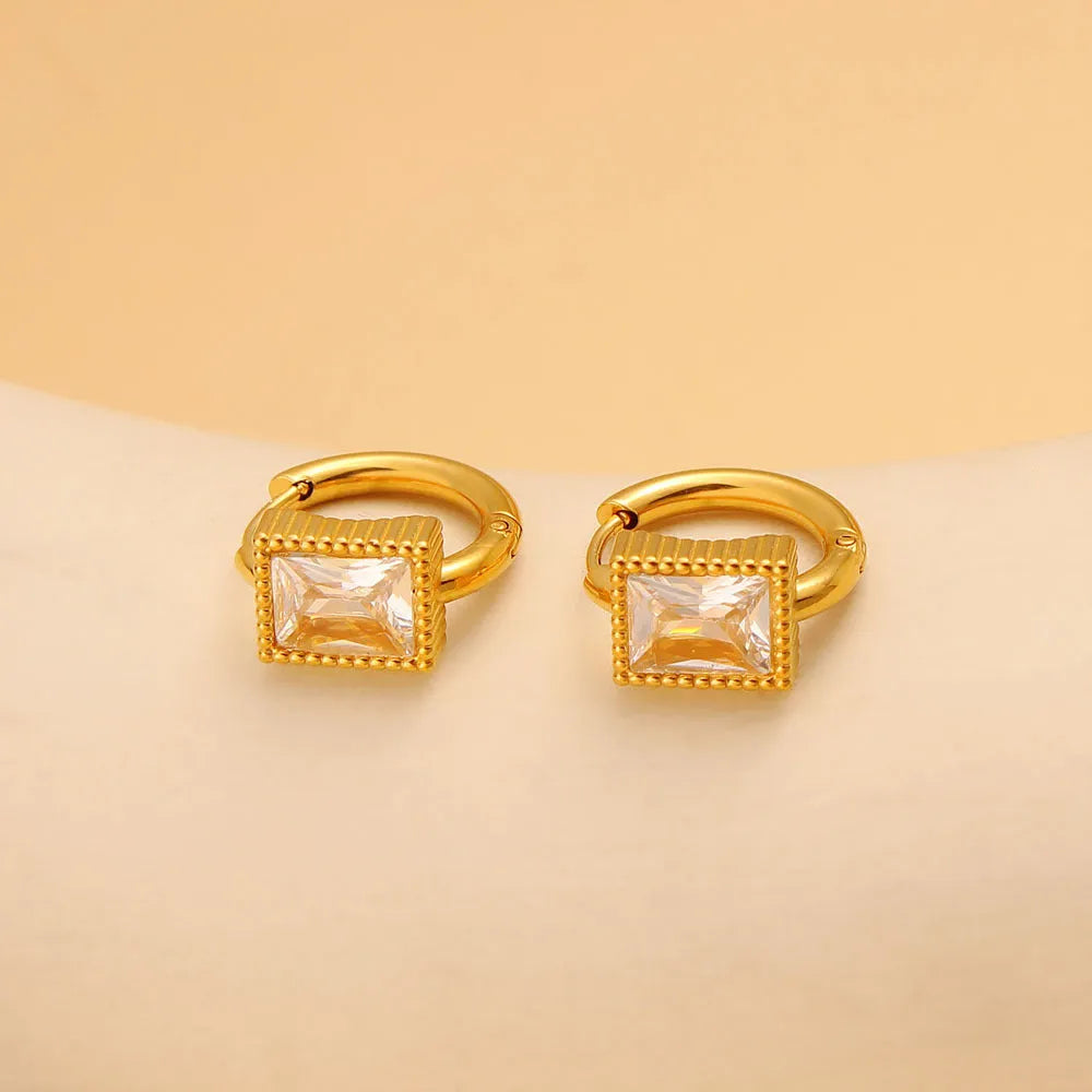 Geometric stainless steel earrings with a square zircon centre and round ring detail in black, green, or white.
