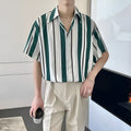 Loose casual ruffian handsome top in green with pointed collar, yarn-dyed fabric