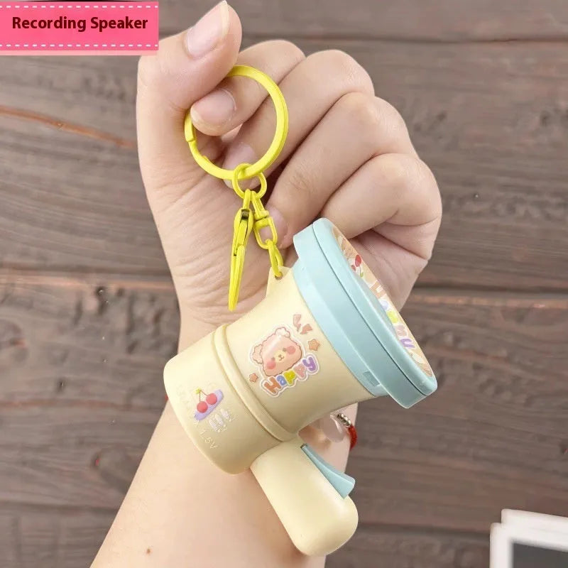 Green cartoon recording horn plastic keychain with integrated ring