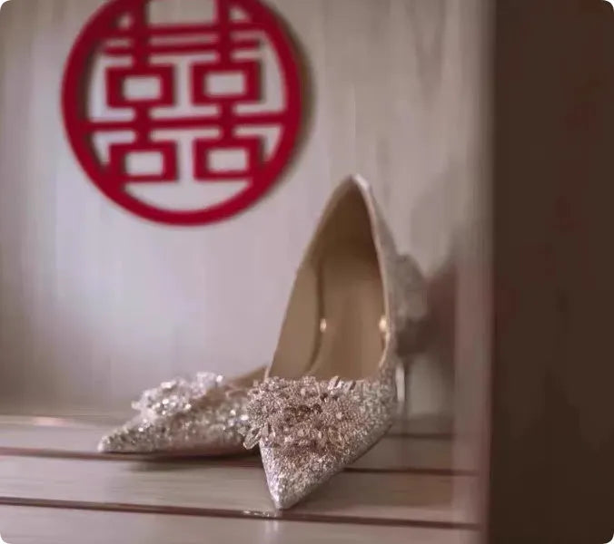 Champagne coloured pointed toe bridal shoes with rhinestone decoration and fine heel