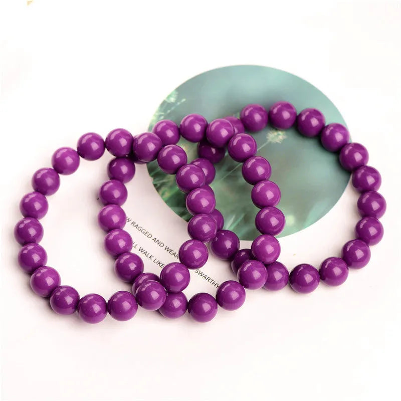 Purple mica crystal bracelet with polished beads, shown in unisex design.