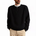 Men's loose grey half zip sweater with textured knit and long sleeves on a hanger.