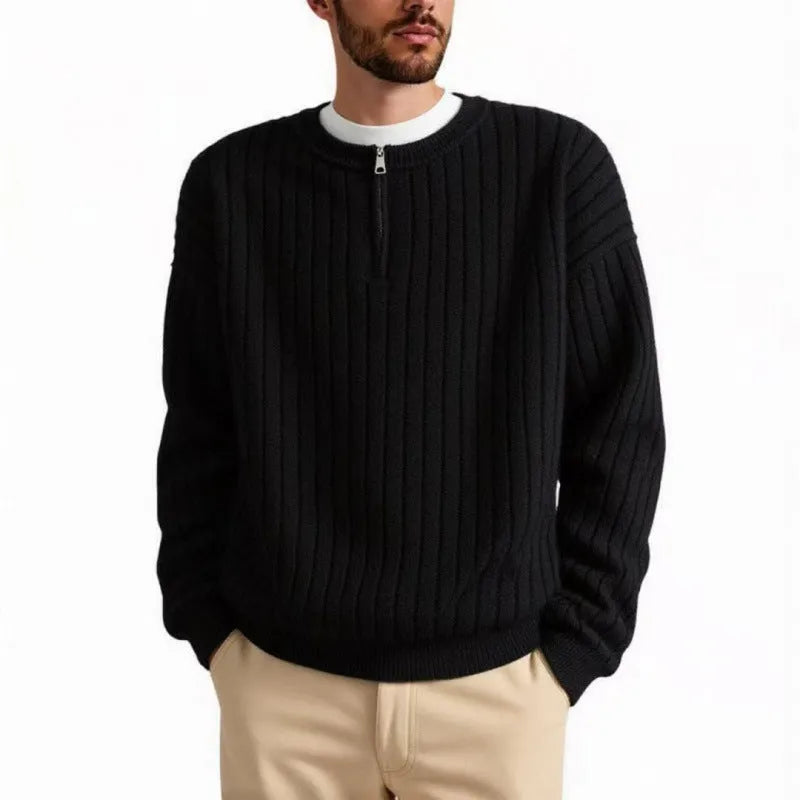 Men's loose grey half zip sweater with textured knit and long sleeves on a hanger.