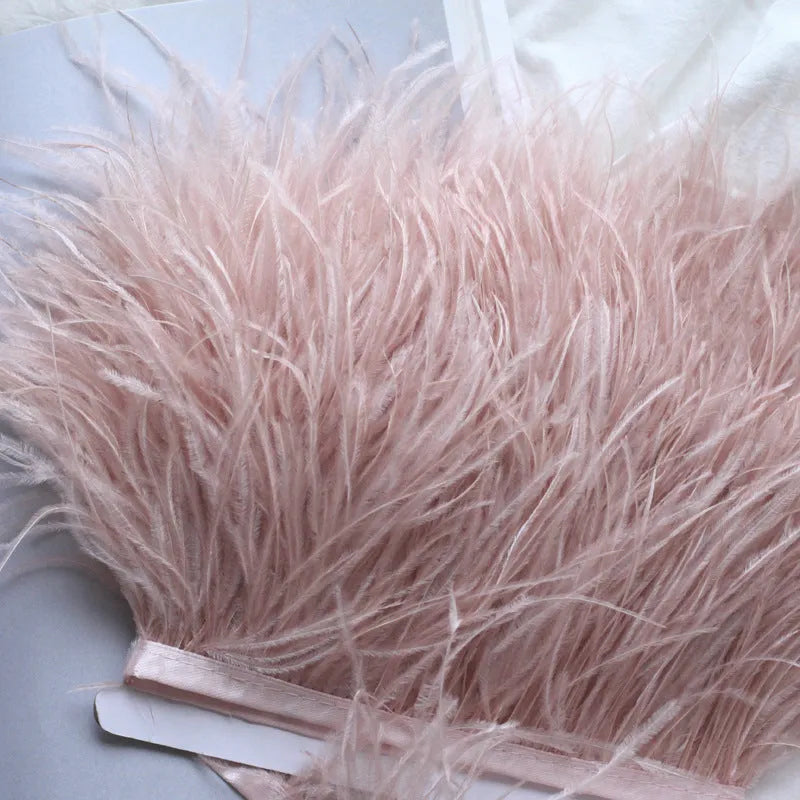Decorative feather cloth strip in multiple colours including white, black, and mint green for DIY clothing and craft projects