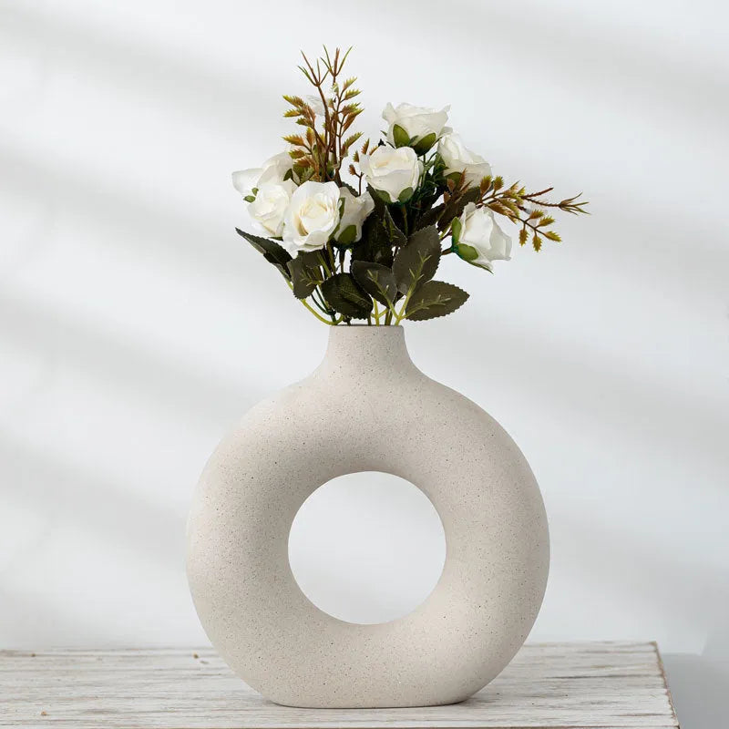 A simple modern frosted porcelain biscuit vase in a neutral colour, for flower arranging.