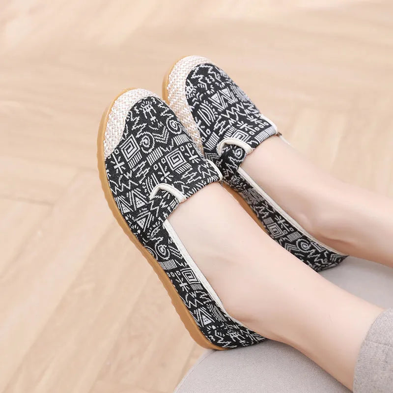 Women's flat-heel ethnic style cloth shoes in assorted colours with colour stitching and a shallow mouth design