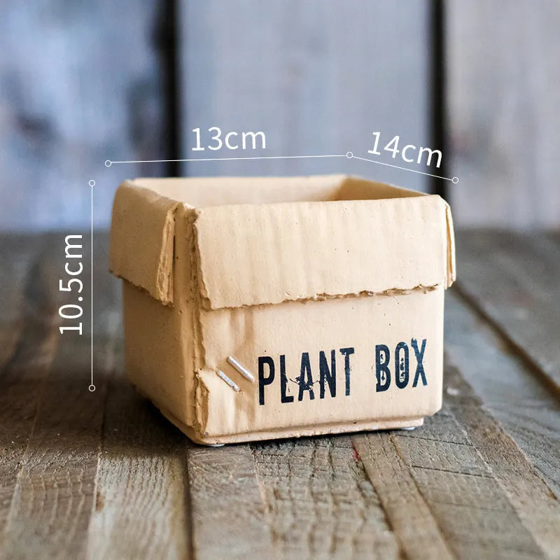 Cement brown paper box style flowerpot with drainage holes for indoor plants