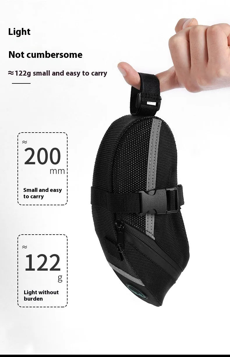 Black quick release bicycle saddle bag mounted under a bike seat