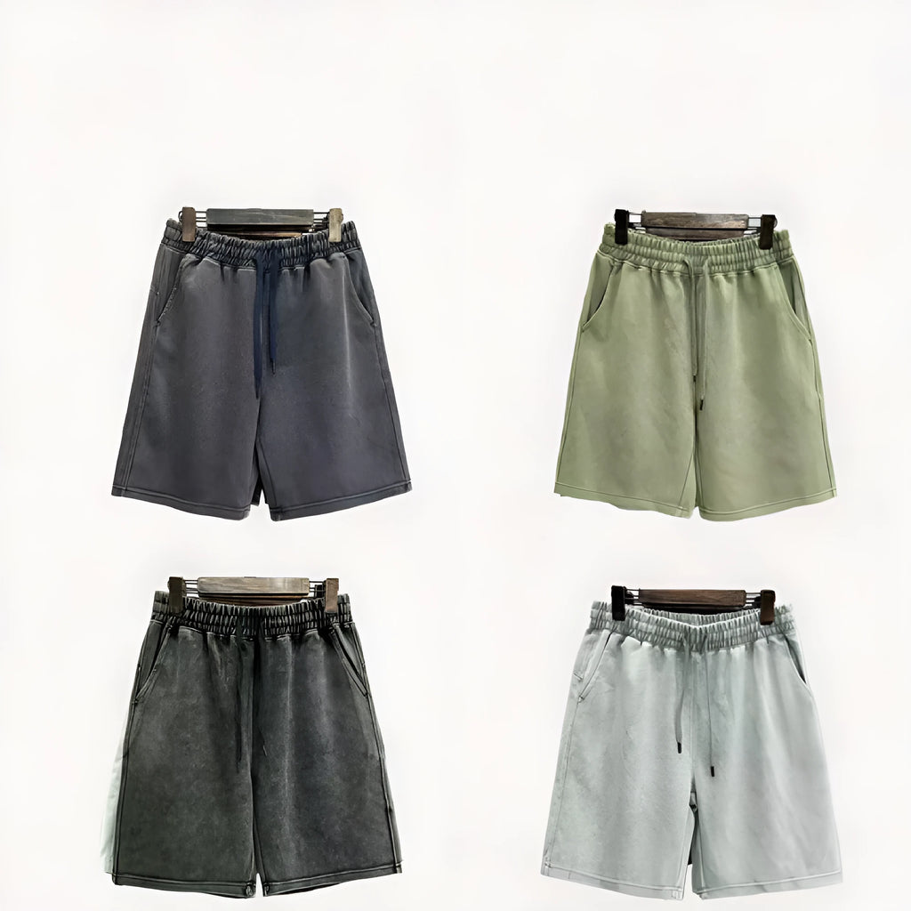 Men's distressed cotton shorts in straight loose fit with solid colour options