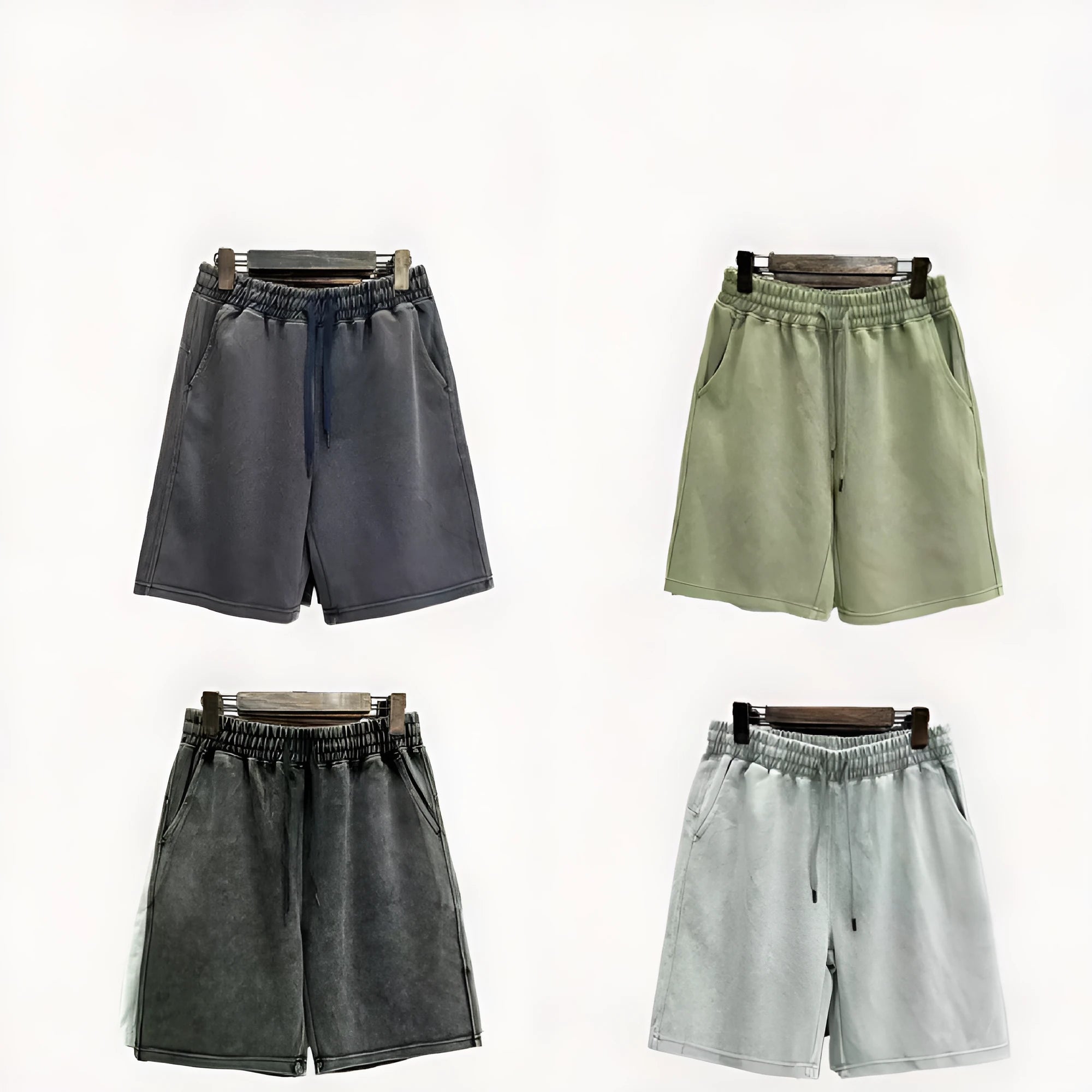 Men's distressed cotton shorts in straight loose fit with solid colour options